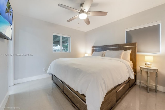 bedroom featuring ceiling fan and baseboards