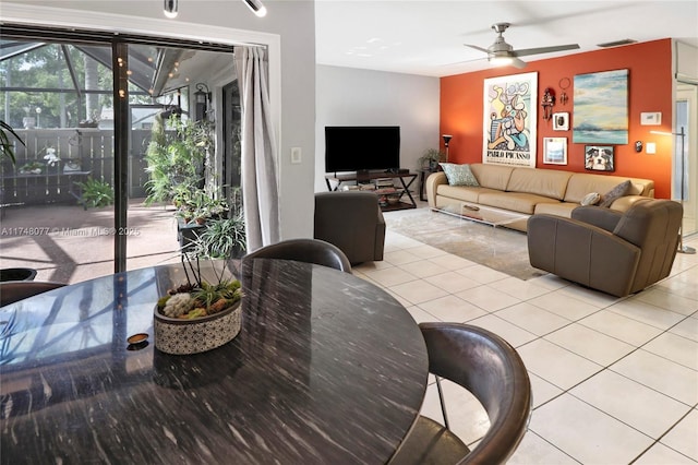 living room with light tile patterned floors and a ceiling fan