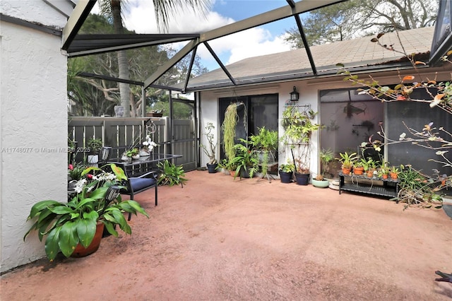 view of patio / terrace with glass enclosure