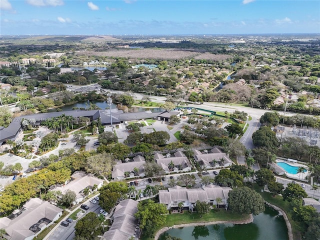 birds eye view of property featuring a water view and a residential view