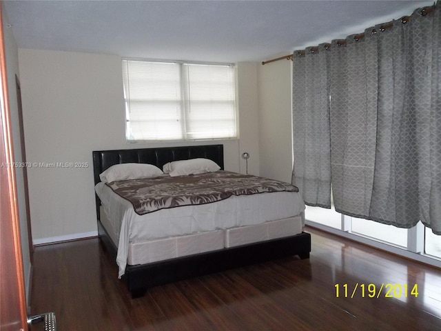 bedroom with wood finished floors