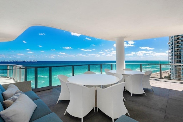 balcony featuring a water view and outdoor lounge area