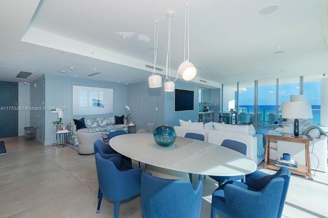 dining room with a wall of windows and visible vents