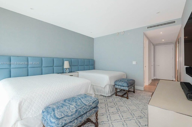 bedroom featuring visible vents and baseboards