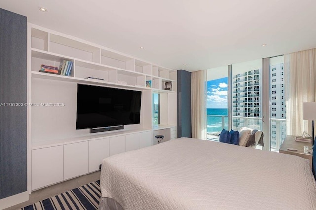 bedroom featuring floor to ceiling windows