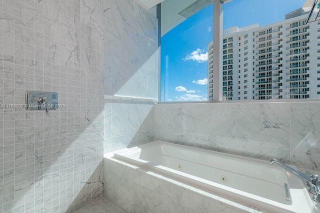 bathroom with a whirlpool tub