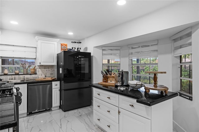 kitchen featuring tasteful backsplash, dark countertops, recessed lighting, white cabinets, and black appliances