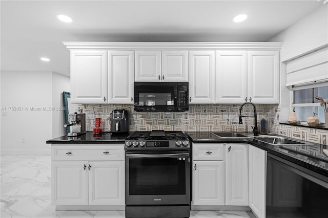 kitchen featuring black microwave, stainless steel gas range oven, recessed lighting, marble finish floor, and backsplash