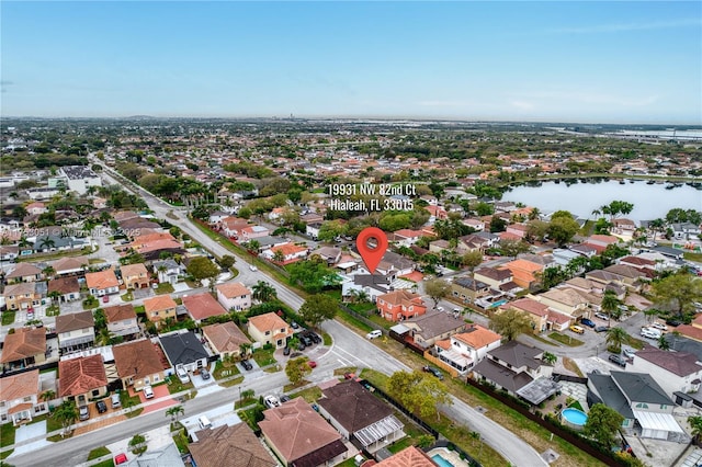 aerial view with a residential view and a water view