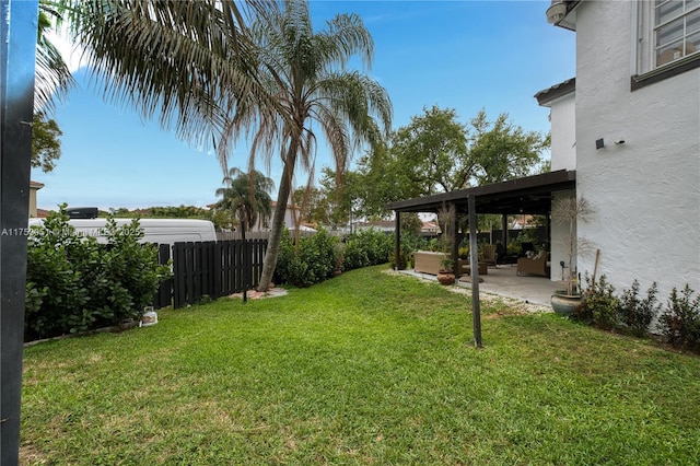 view of yard with a patio area and a fenced backyard