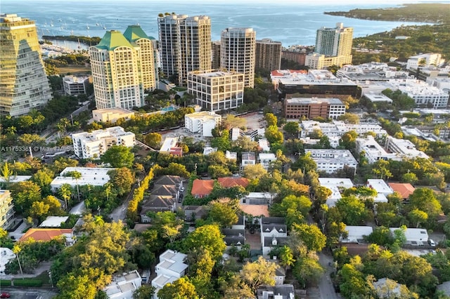 birds eye view of property featuring a view of city and a water view