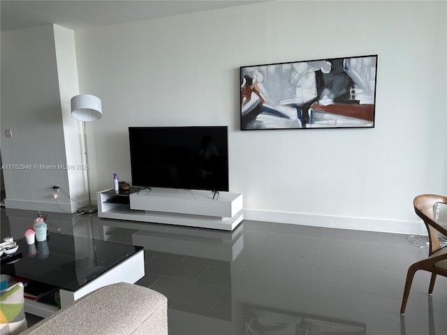 living room featuring baseboards