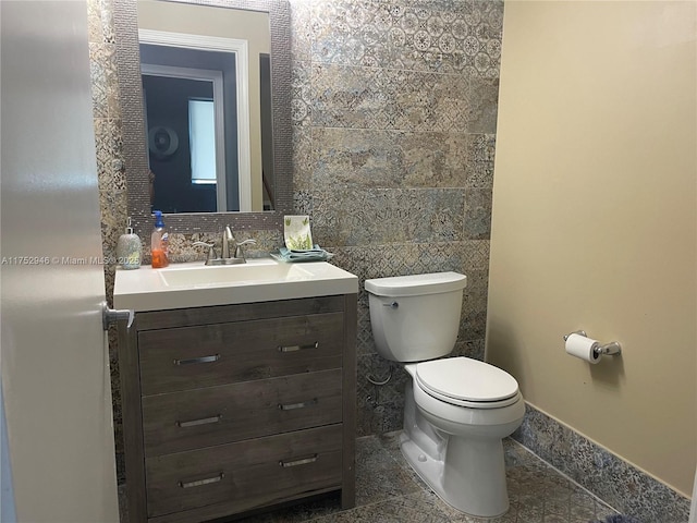 bathroom featuring toilet and vanity