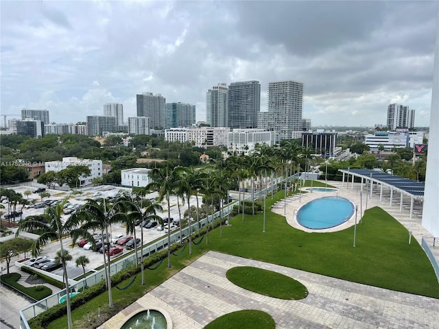 view of swimming pool featuring a view of city
