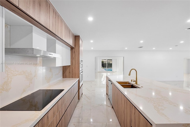 kitchen featuring black electric cooktop, a sink, marble finish floor, wall chimney exhaust hood, and modern cabinets