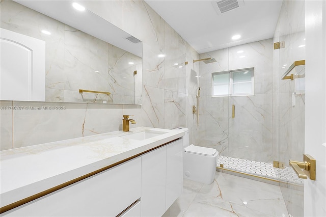 bathroom with toilet, visible vents, tile walls, marble finish floor, and a marble finish shower