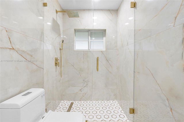 bathroom with toilet, a marble finish shower, and tile walls