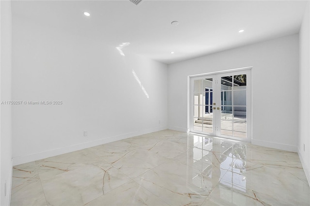 empty room featuring marble finish floor, french doors, recessed lighting, and baseboards