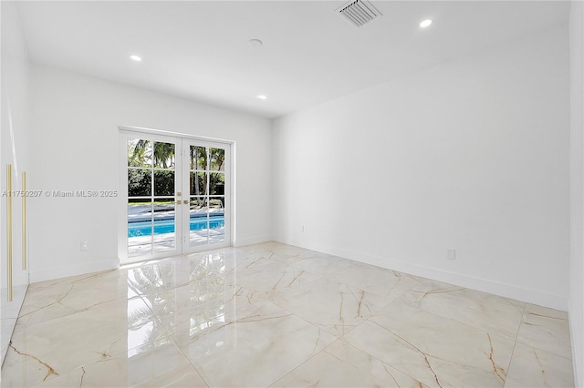 spare room with baseboards, visible vents, marble finish floor, french doors, and recessed lighting