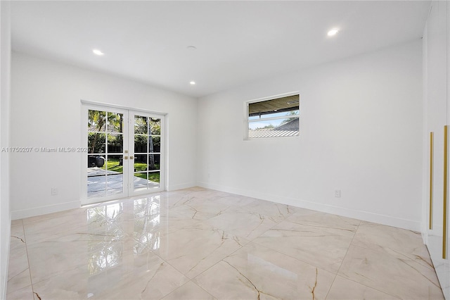 empty room featuring marble finish floor, french doors, recessed lighting, and baseboards