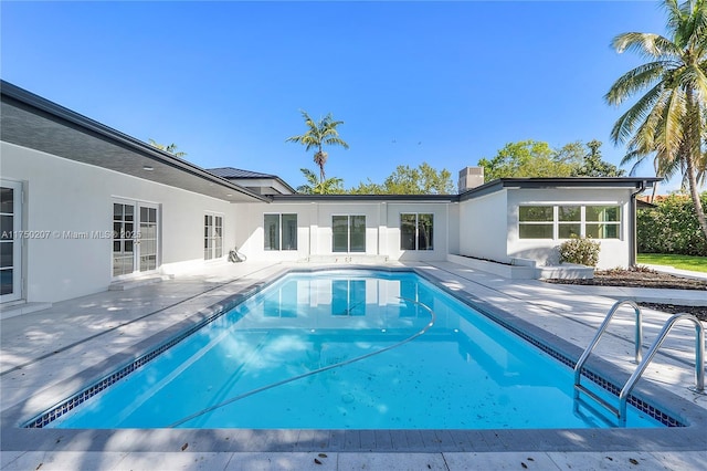 pool with a patio area