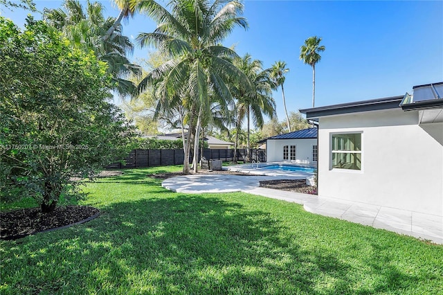 view of yard with a patio, a fenced backyard, and a fenced in pool