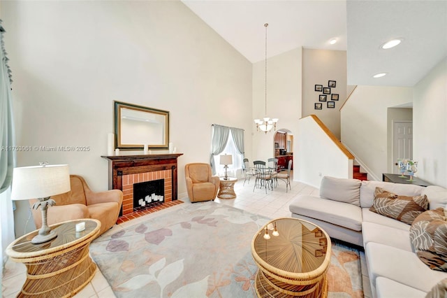 tiled living area featuring high vaulted ceiling, recessed lighting, a fireplace, stairs, and an inviting chandelier