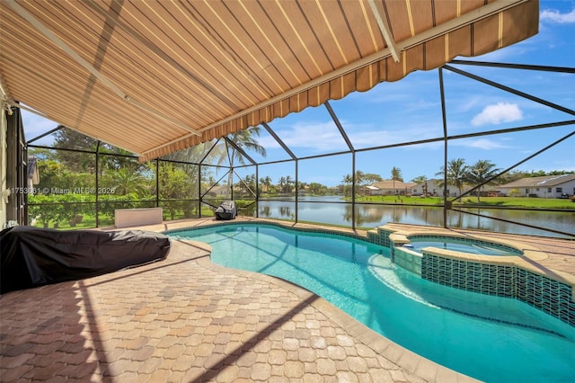 view of pool with a lanai, a water view, a pool with connected hot tub, and a patio