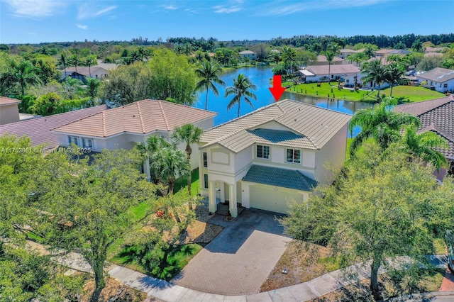 bird's eye view with a residential view and a water view