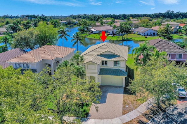 drone / aerial view with a residential view and a water view