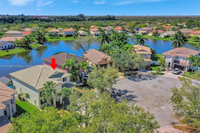 aerial view featuring a water view and a residential view