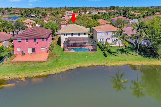 birds eye view of property with a water view and a residential view