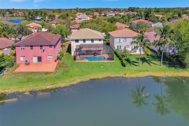 birds eye view of property featuring a water view and a residential view