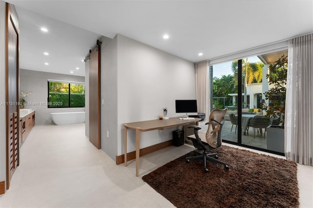 office area featuring a barn door and recessed lighting