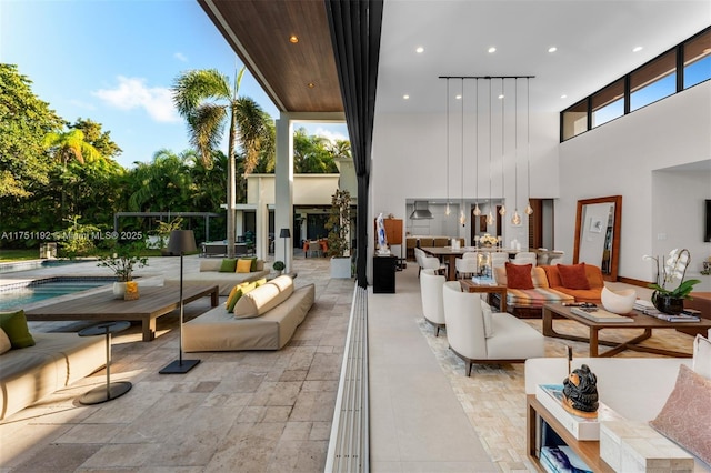 interior space with a towering ceiling and recessed lighting