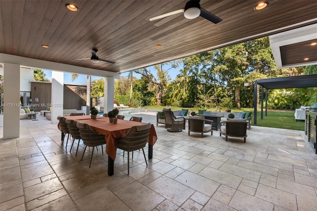 view of patio / terrace featuring an outdoor hangout area, an outdoor pool, a ceiling fan, and outdoor dining space