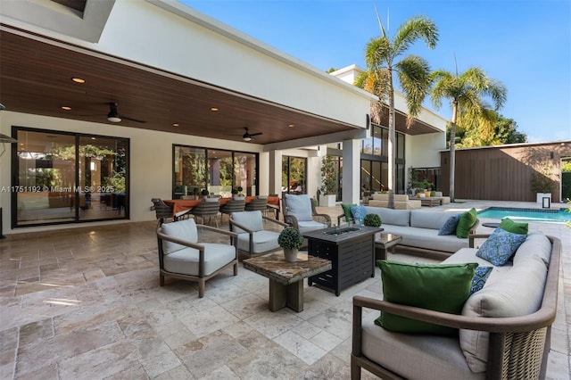 view of patio featuring a fenced in pool, an outdoor living space with a fire pit, a ceiling fan, and fence