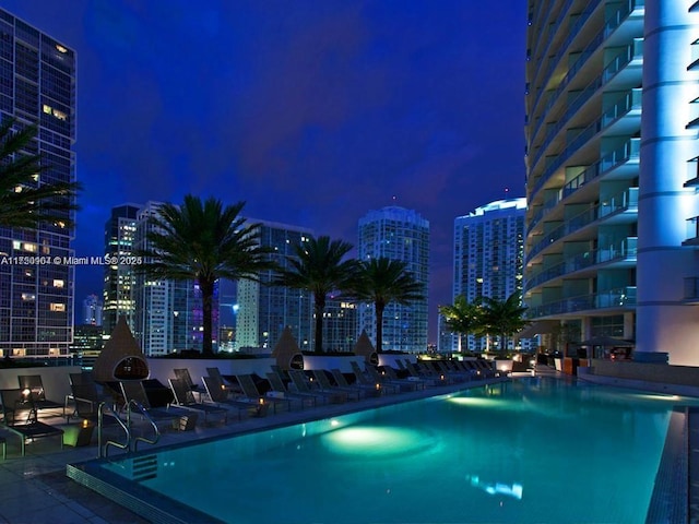 pool at night with a view of city lights