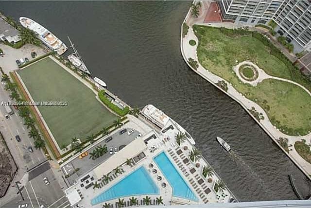 birds eye view of property with a water view