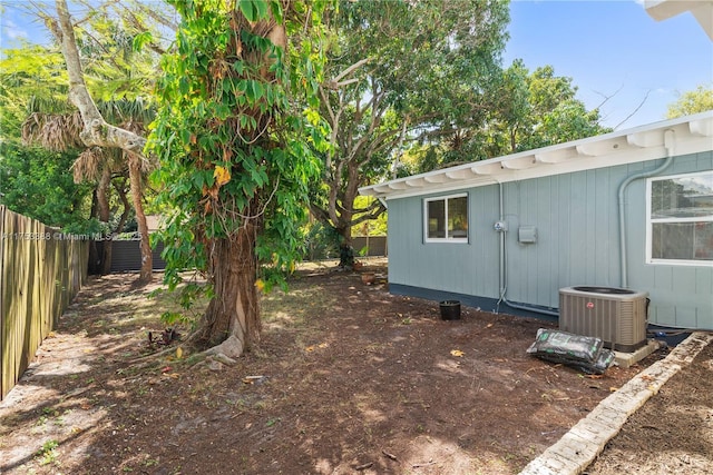 view of yard featuring central air condition unit and a fenced backyard