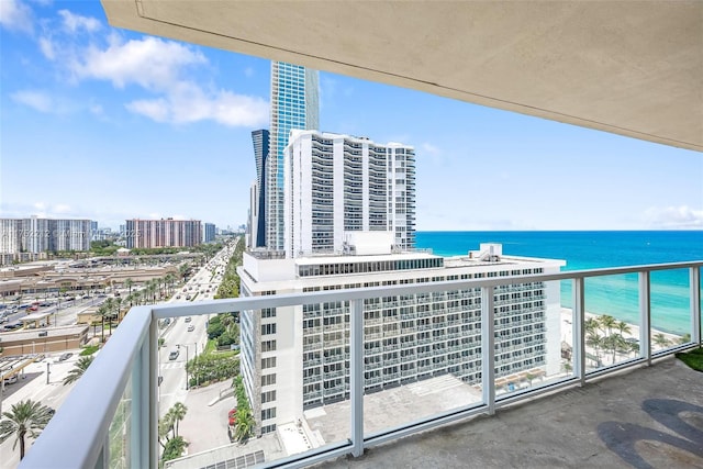 balcony featuring a view of city and a water view