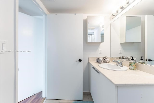 bathroom with tile patterned floors and vanity