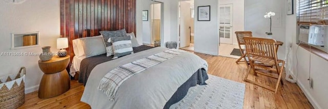 bedroom with wood finished floors