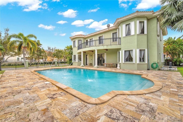 view of swimming pool featuring a fenced in pool, a patio, and fence