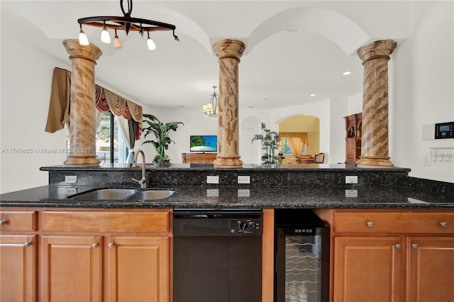 kitchen featuring a sink, decorative columns, wine cooler, and dishwasher