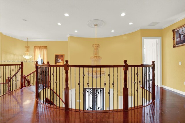 hallway featuring crown molding, recessed lighting, an upstairs landing, wood finished floors, and baseboards