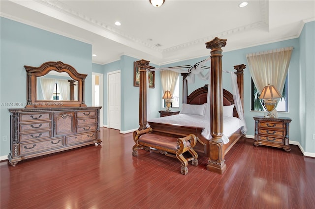 bedroom featuring dark wood-style floors, multiple windows, and ornamental molding