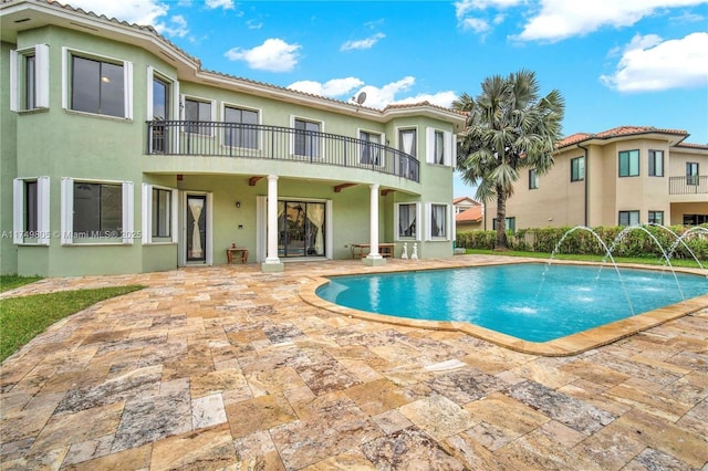 outdoor pool featuring a patio area