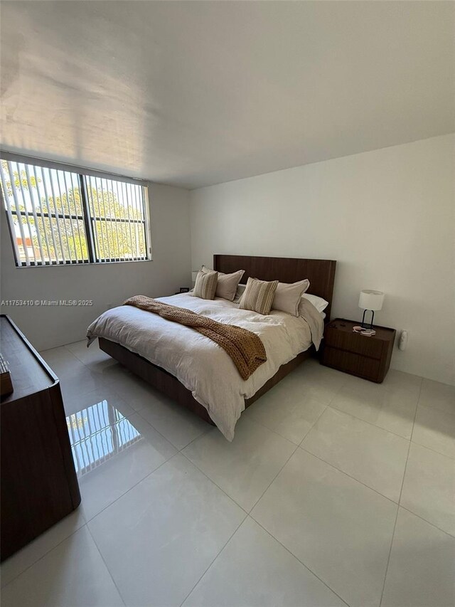 bedroom with tile patterned floors