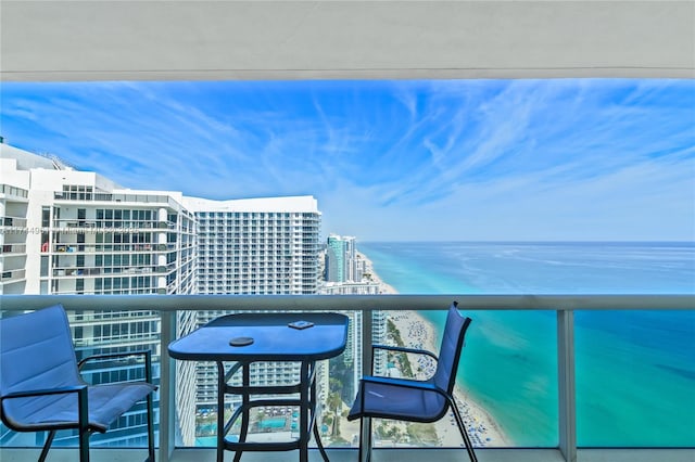 balcony featuring a water view and a view of city